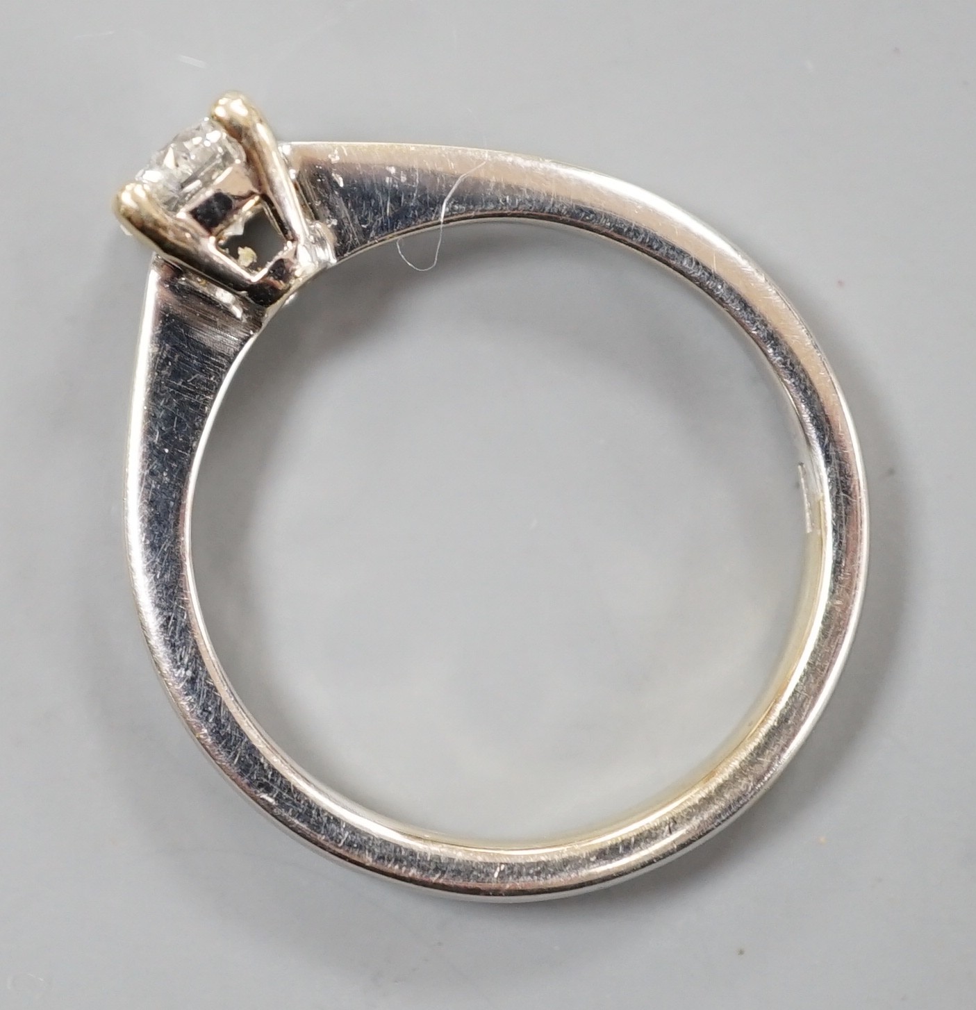 A modern Italian 750 white metal and solitaire diamond ring, size L/M, gross weight 2.8 grams.